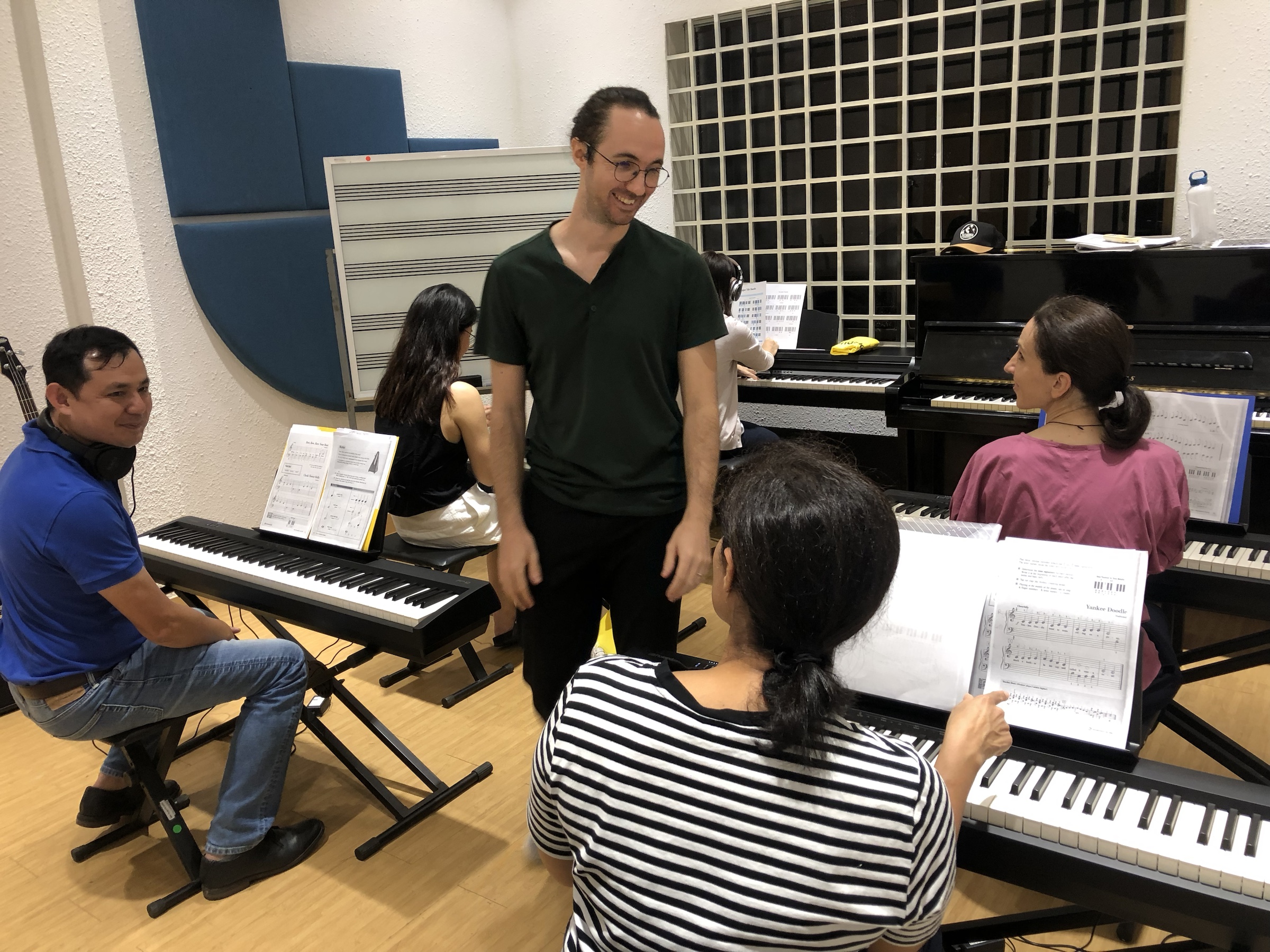 Piano student working with a teacher at Soundskool